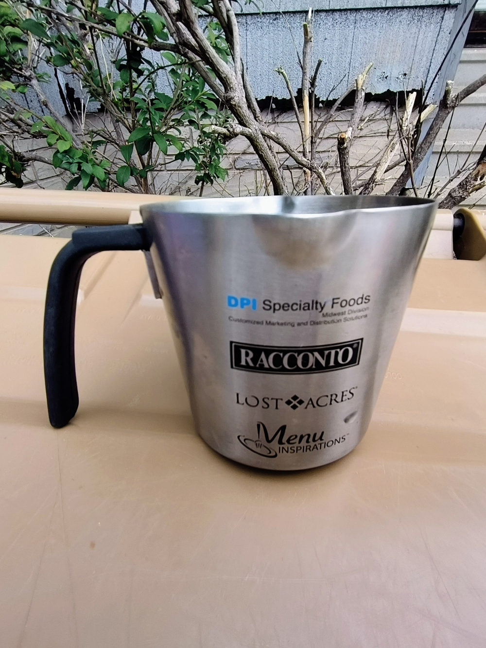 Racconto Stainless Steel Measuring Cup with Black Handle - Brand Logos